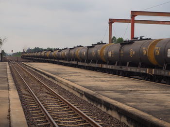 Train on railroad track against sky