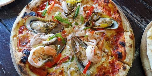 High angle view of pizza in plate on table