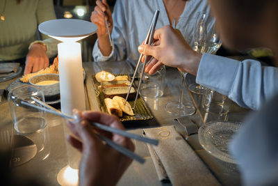 Midsection of man preparing food