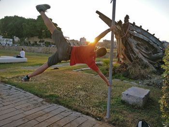 Man in park against sky