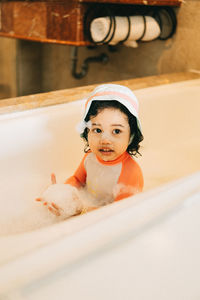 Portrait of cute boy in bathroom