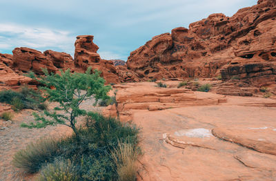 Rock formations on landscape against sky