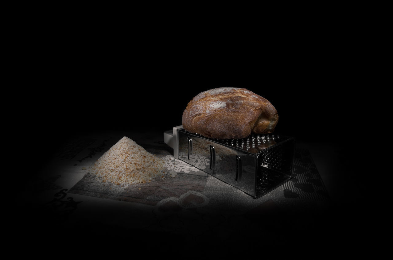 CLOSE-UP OF BREAD ON TABLE