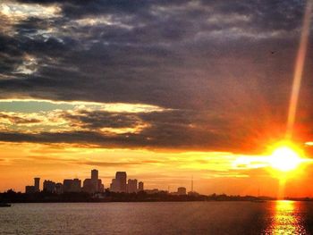 Scenic view of river at sunset