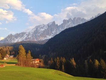 Scenic view of landscape and mountains against sky