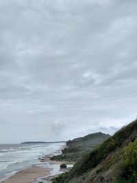 Scenic view of beach and sea against sky