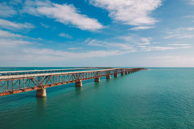 Pier over sea against sky