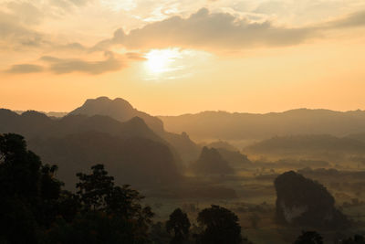 Scenic view of mountains against sky during sunset