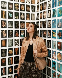 Portrait of woman standing in corridor