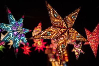 Close-up of illuminated christmas lights at night