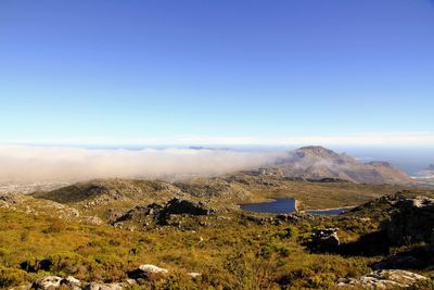 Scenic view of landscape against blue sky
