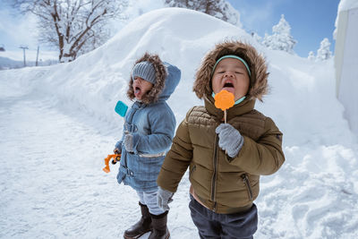 Portrait of smiling boy holding ice