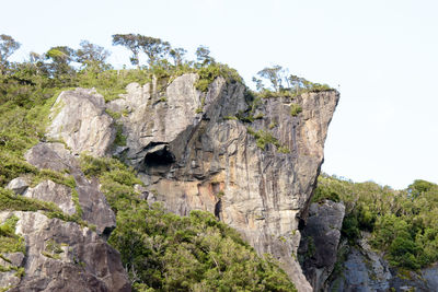 Low angle view of rock formation against sky