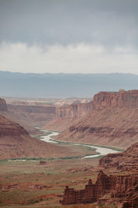 View of the colorado river under cloudy skies outside of moab utah