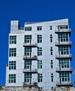 Low angle view of building against blue sky