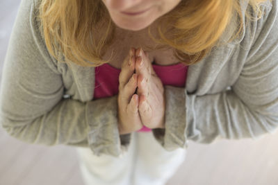 High angle view of woman praying