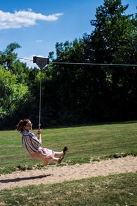 Bicycle parked on swing at playground