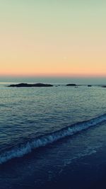 Scenic view of sea at sunset