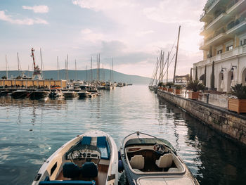 Boats moored at harbor