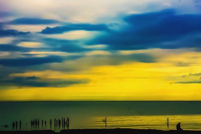 Scenic view of sea against cloudy sky