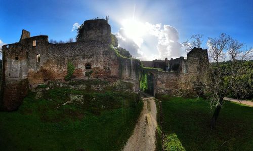 View of old building against cloudy sky