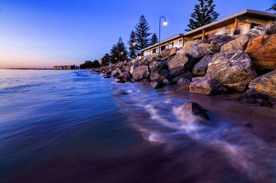 Pile of rocks and huts at glenelg beach