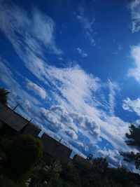 Low angle view of buildings against blue sky