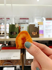 Close-up of hand holding ice cream