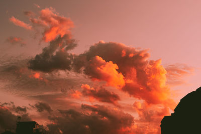 Low angle view of dramatic sky during sunset