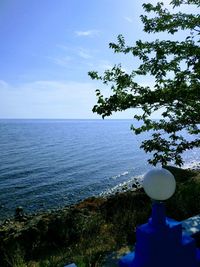 Scenic view of sea against blue sky