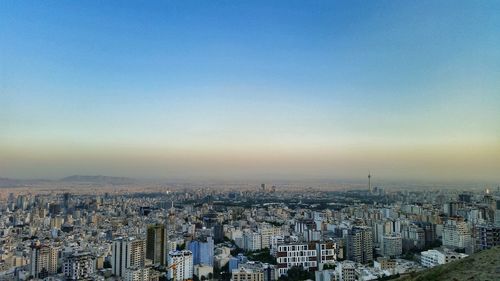 High angle view of buildings against sky during sunset