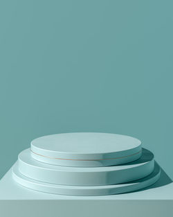 Stack of empty table against blue wall