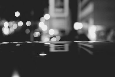 Defocused image of illuminated city at night