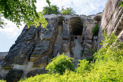 Low angle view of old ruins against sky