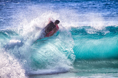 Man surfing in sea