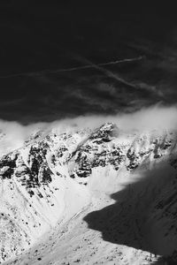 Scenic view of snow covered mountains against sky