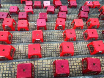 High angle view of red stools on steps