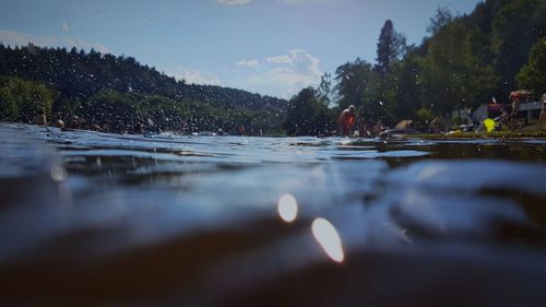 Surface level of lake against sky