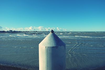 Scenic view of sea against blue sky