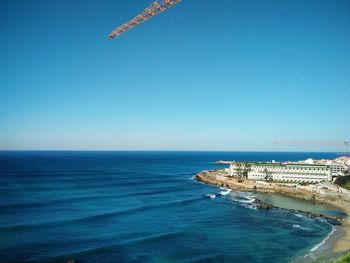 Scenic view of sea against clear blue sky