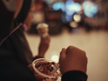 Close-up of hand holding ice cream 