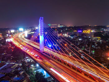 High angle view of light trails on road at night