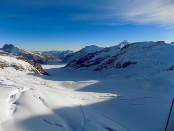 Scenic view of snow covered mountains