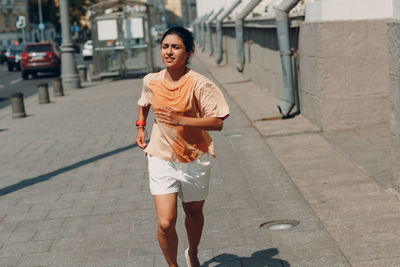 Woman jogging in city