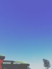 Low angle view of built structure against clear blue sky