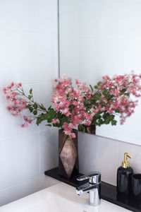 Clean bathroom with pink flowers.