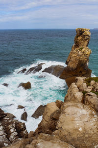 Scenic view of cabo carvoeirp rocks in sea against sky