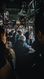 Rear view of people in train