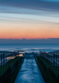 Scenic view of sea against sky during sunrise