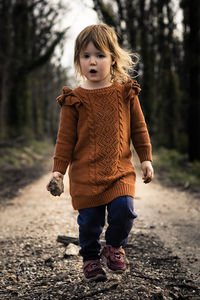 Full length of cute girl standing on land